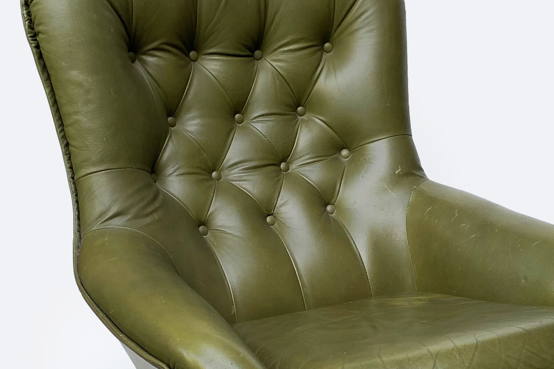 Swivel armchair in olive green leather 1970s