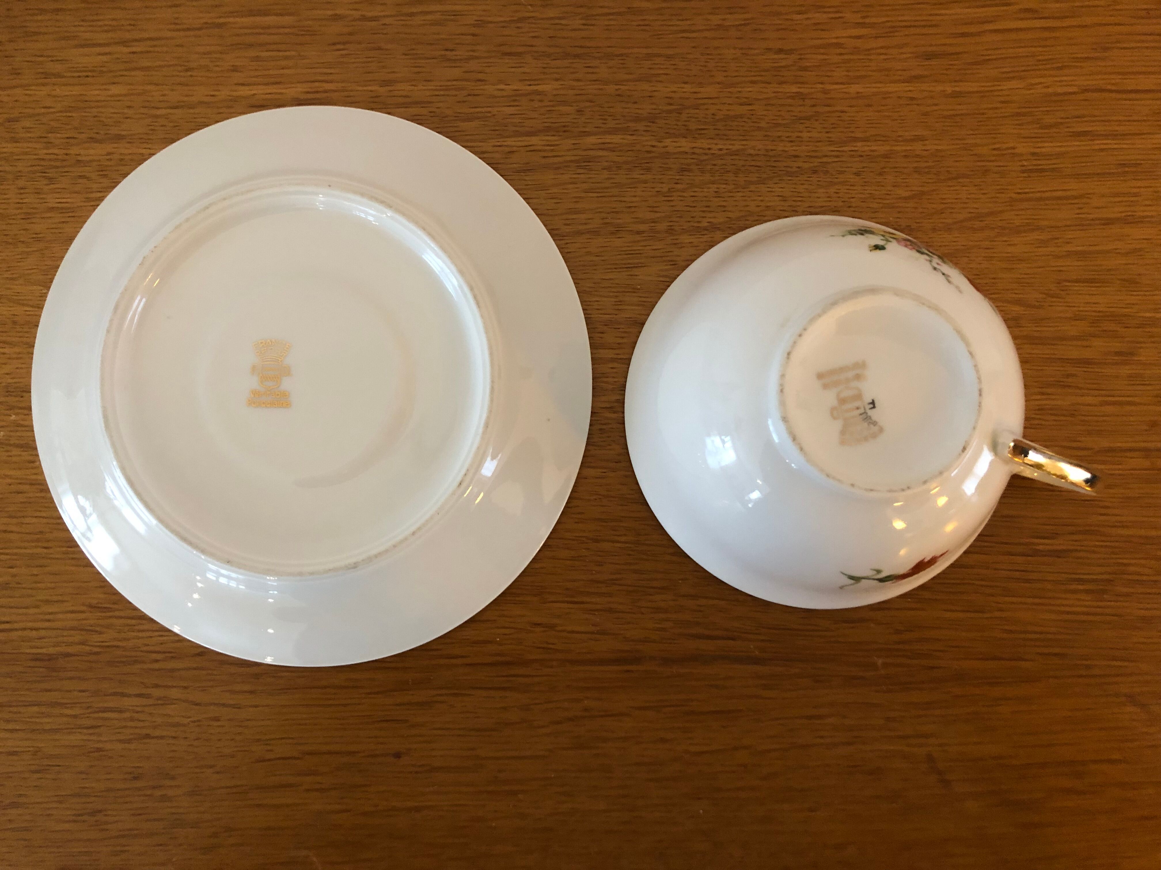 2 porcelain teacups and under teacups floral motifs