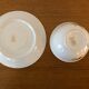 2 porcelain teacups and under teacups floral motifs