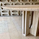 Round travertine dining table with double cross foot