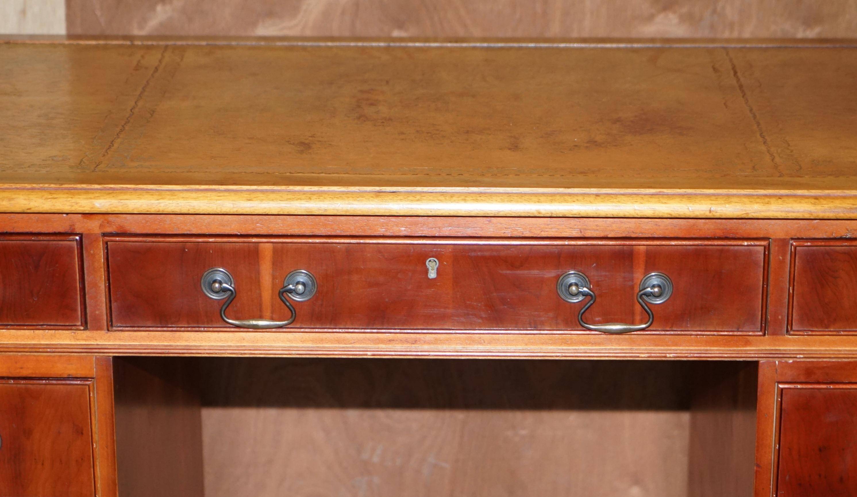 Vintage walnut desk with a leather top and two drawers.