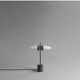 Lampe de table en métal oxydé et verre opalin, œuvre contemporaine.