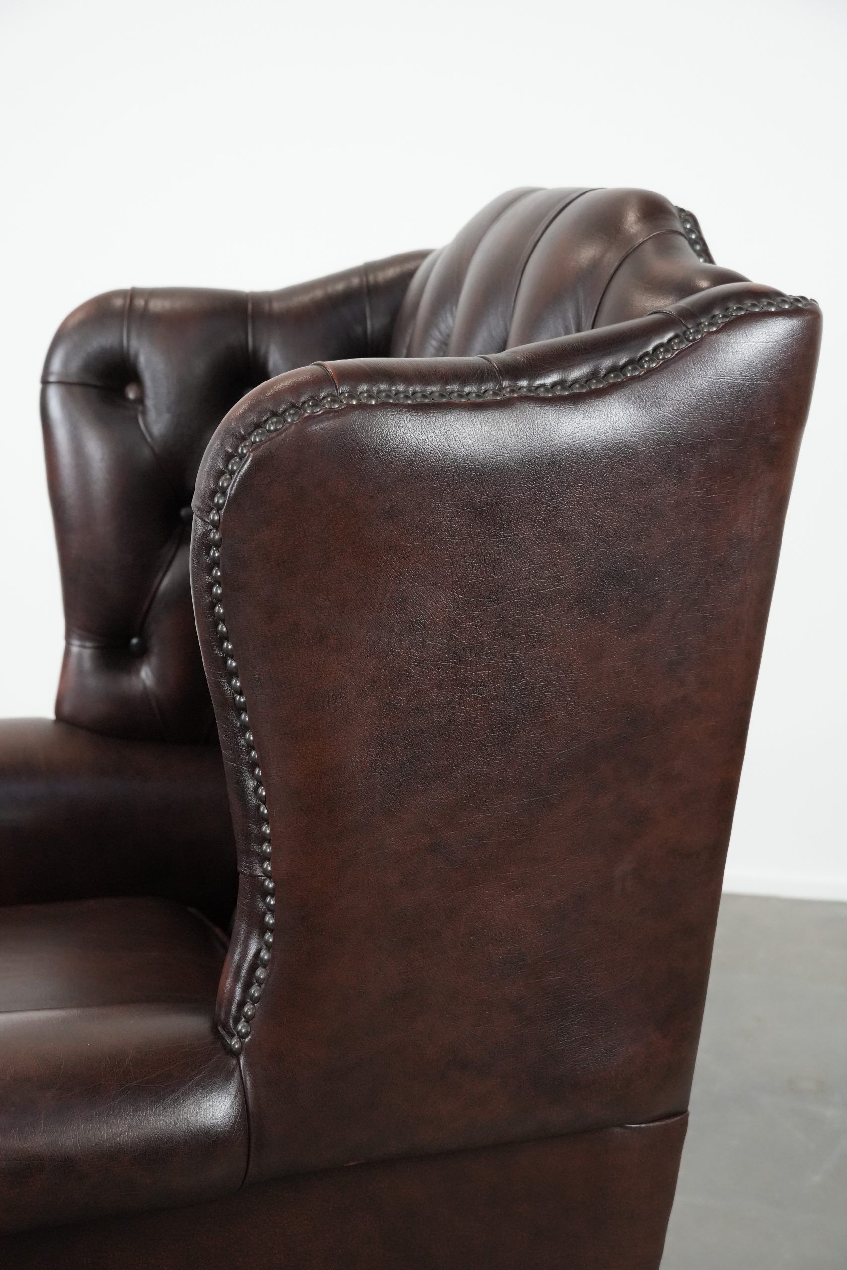 Brown cowhide leather Chesterfield wingback armchair in English style