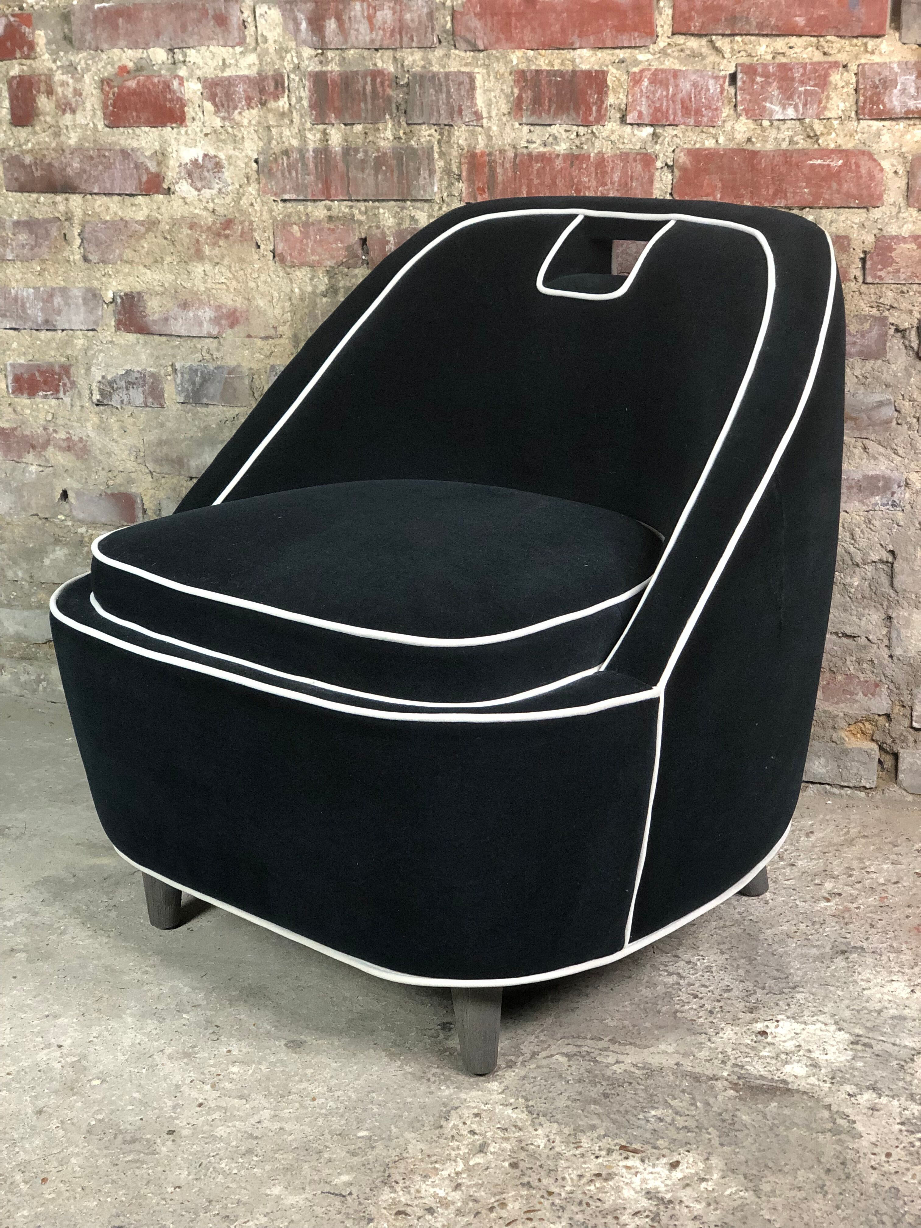 Retro vintage 80's armchair in black velvet with white trim