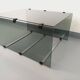 Table basse vintage en verre fumé, métal noir et fonte d’aluminium
