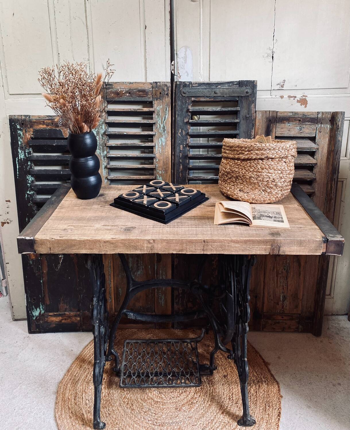 Vintage wooden table with a cast iron base.