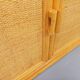 Vintage storage unit in rattan and woven rattan from the 1970s.