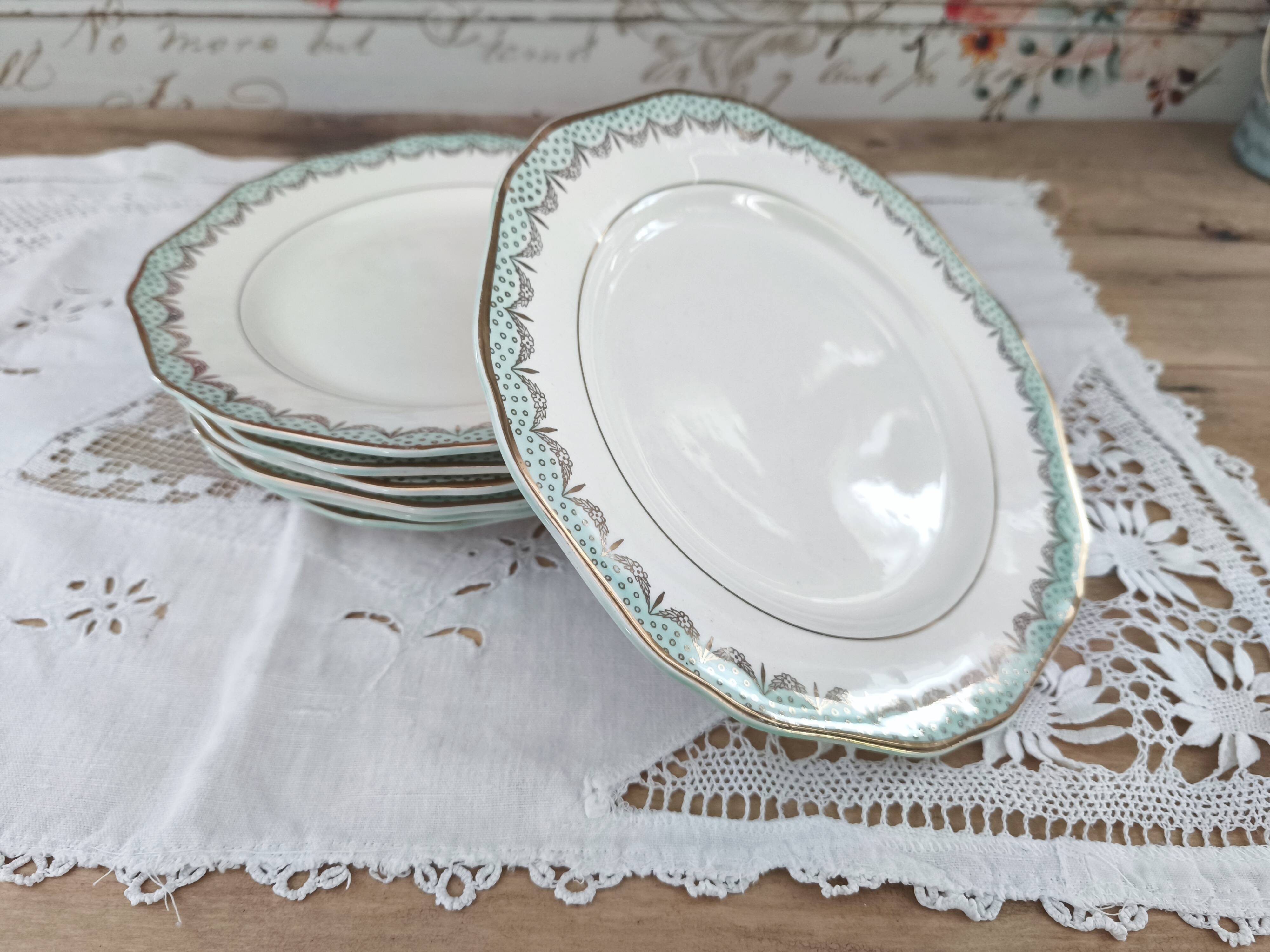 Set of 7 Longwy France earthenware dessert plates, Trianon model