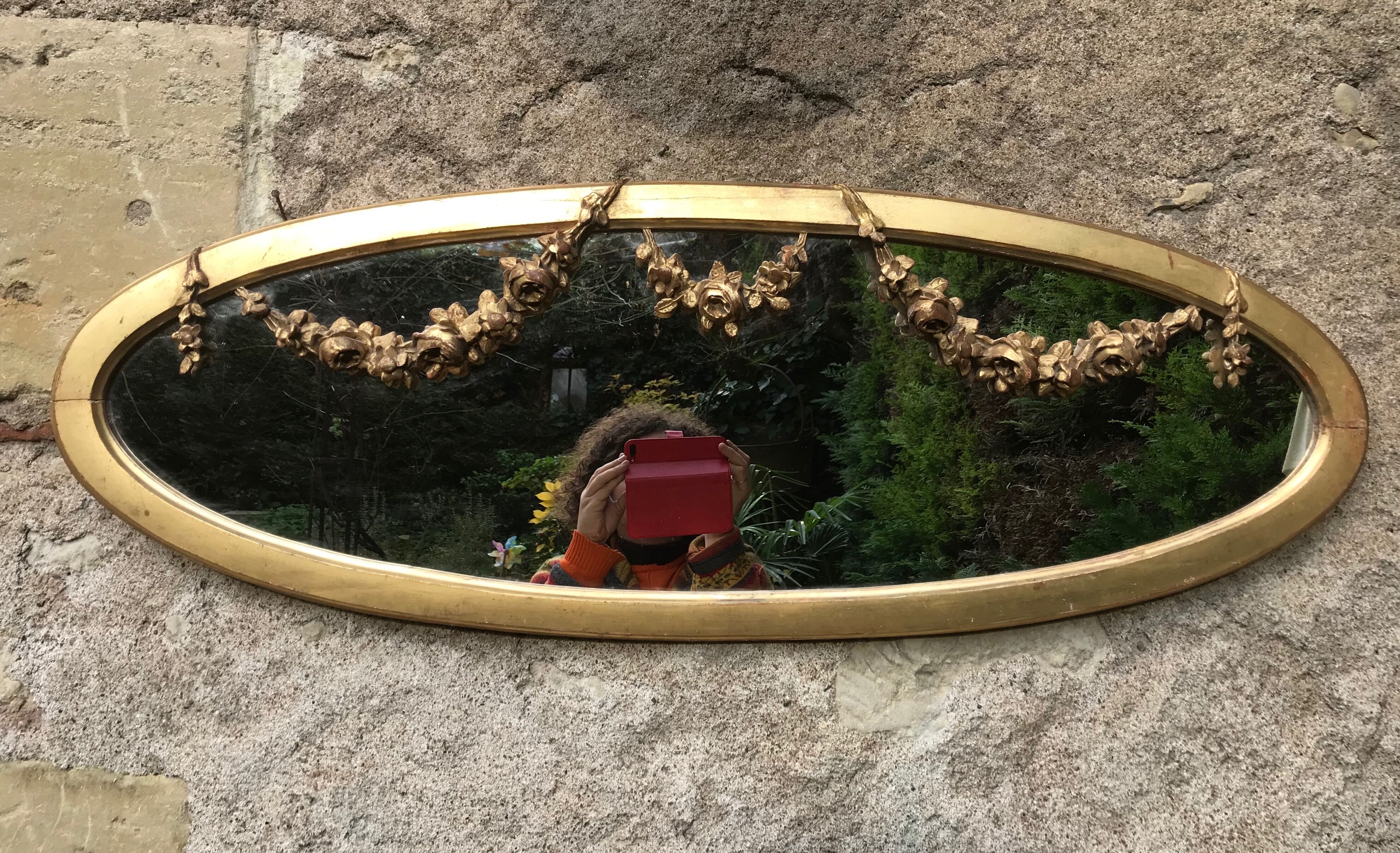 Golden oval mirror with gold leaf 106 x 38 cm