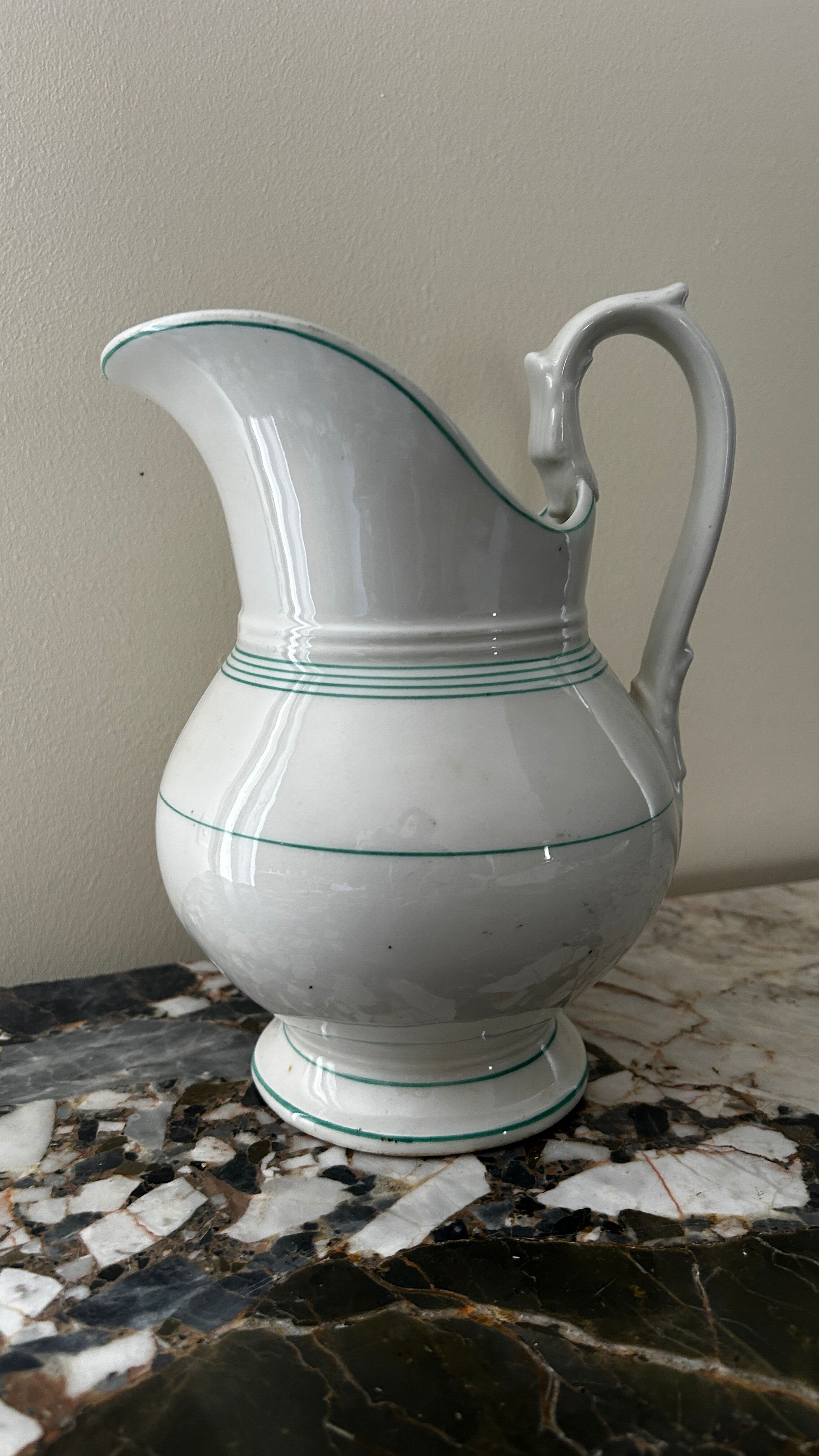 White toilet jug with green trim