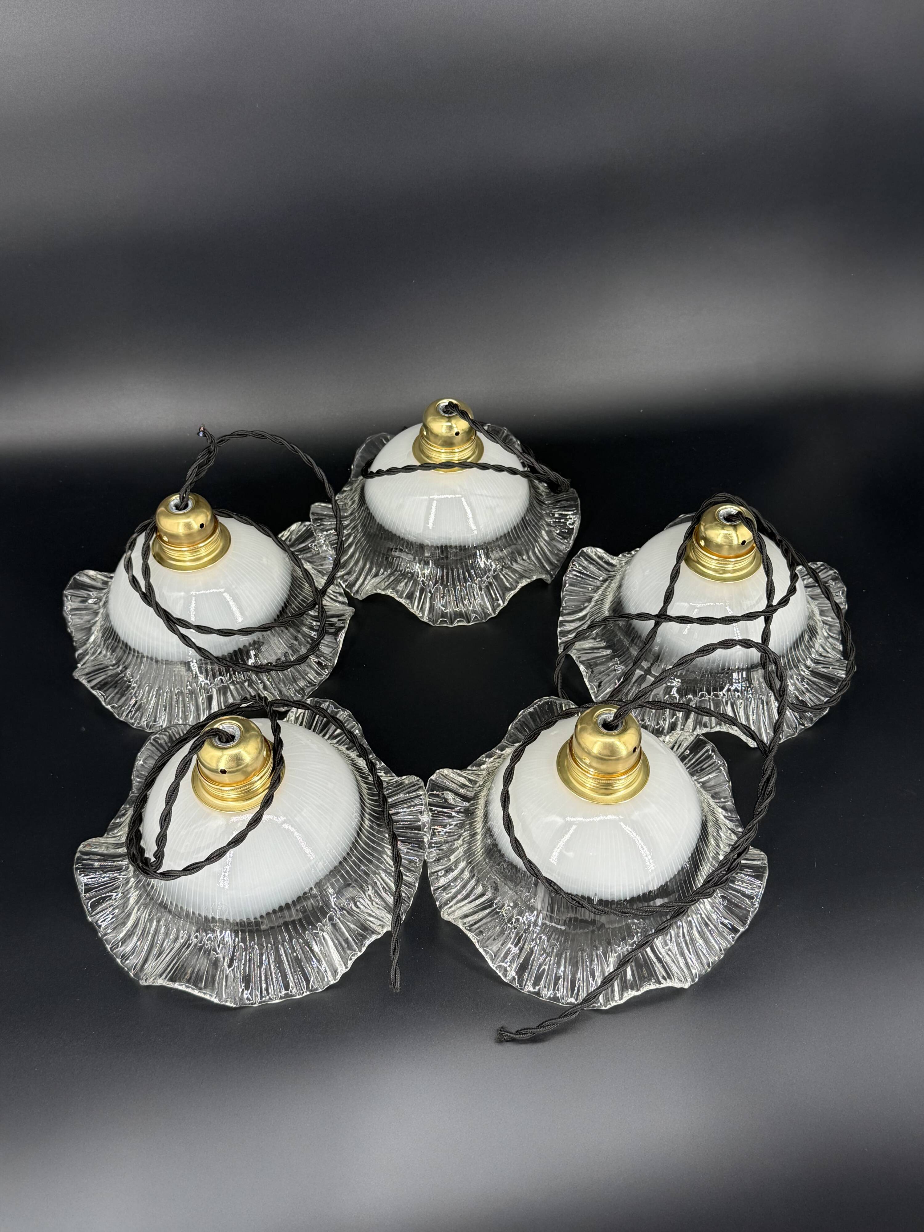 Set of 5 scalloped white opaline flower pendants, braided black cable.