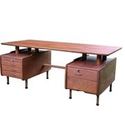 Vintage 1950s teak desk by designer Jacques Hauville.
