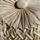 Round yoga cushion made of off-white fabric