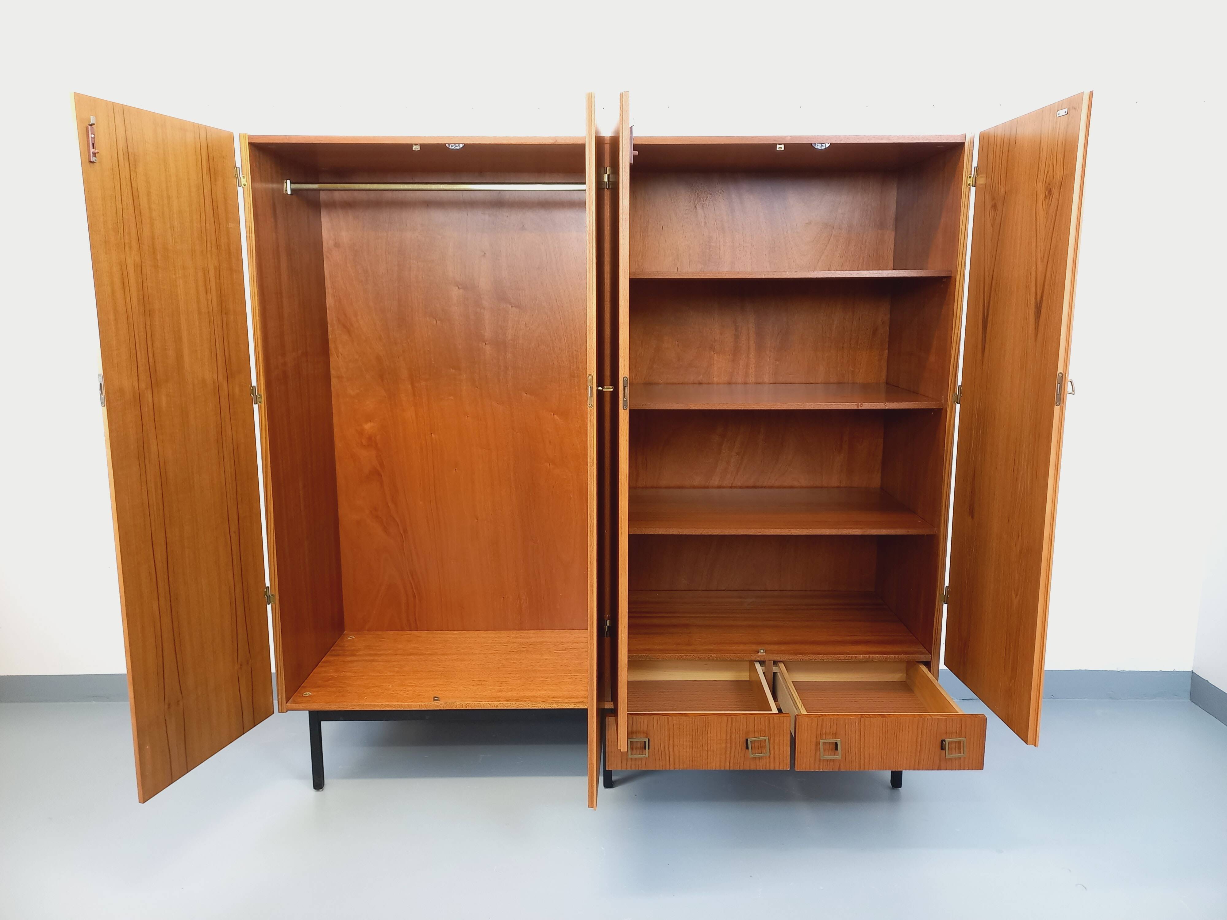 Vintage modernist wardrobe in teak and metal from the 1960s.