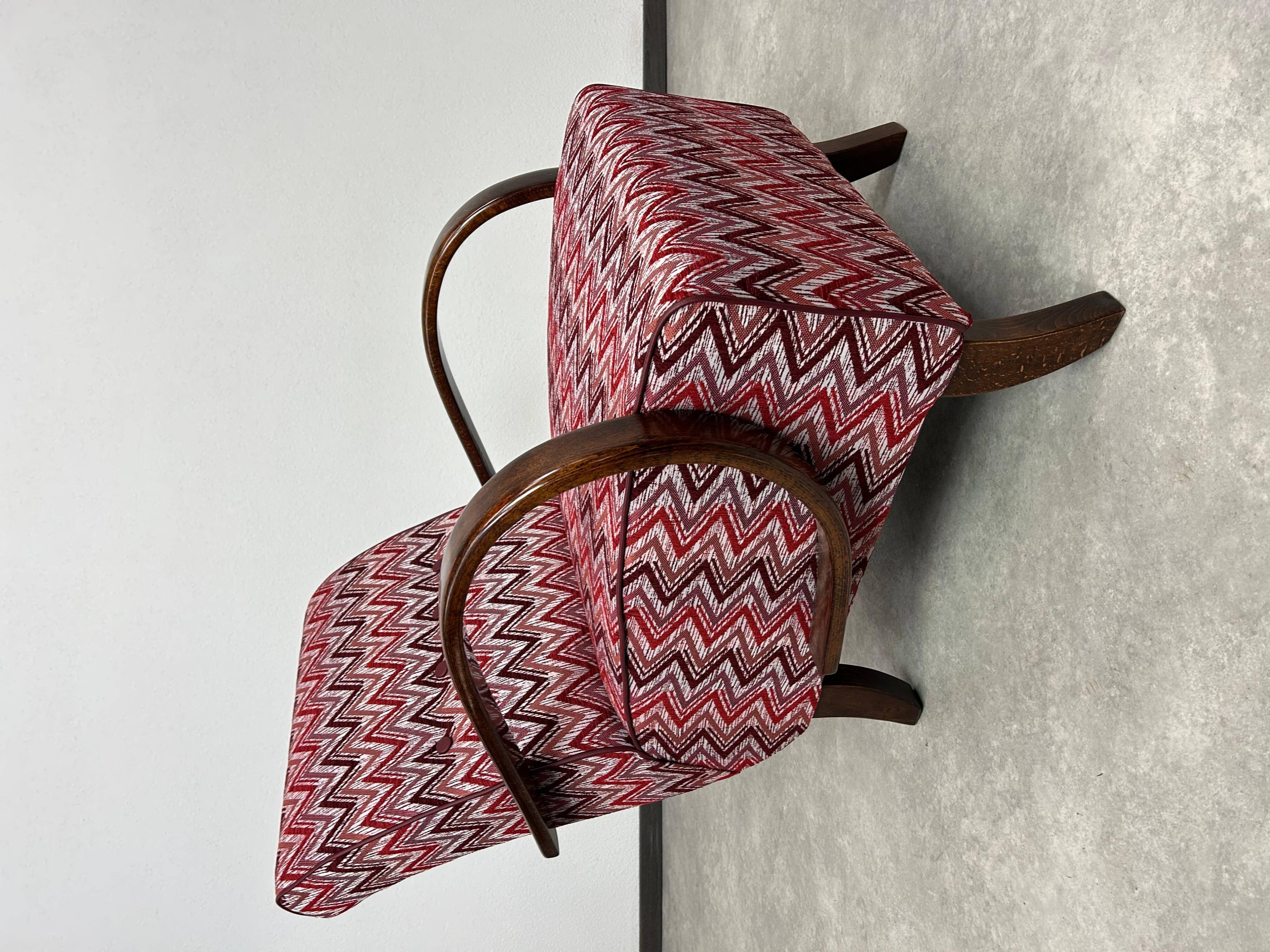 C-shaped lounge chair by J. Halabala
