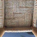 Wooden stool seated in braided rope