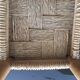 Wooden stool seated in braided rope