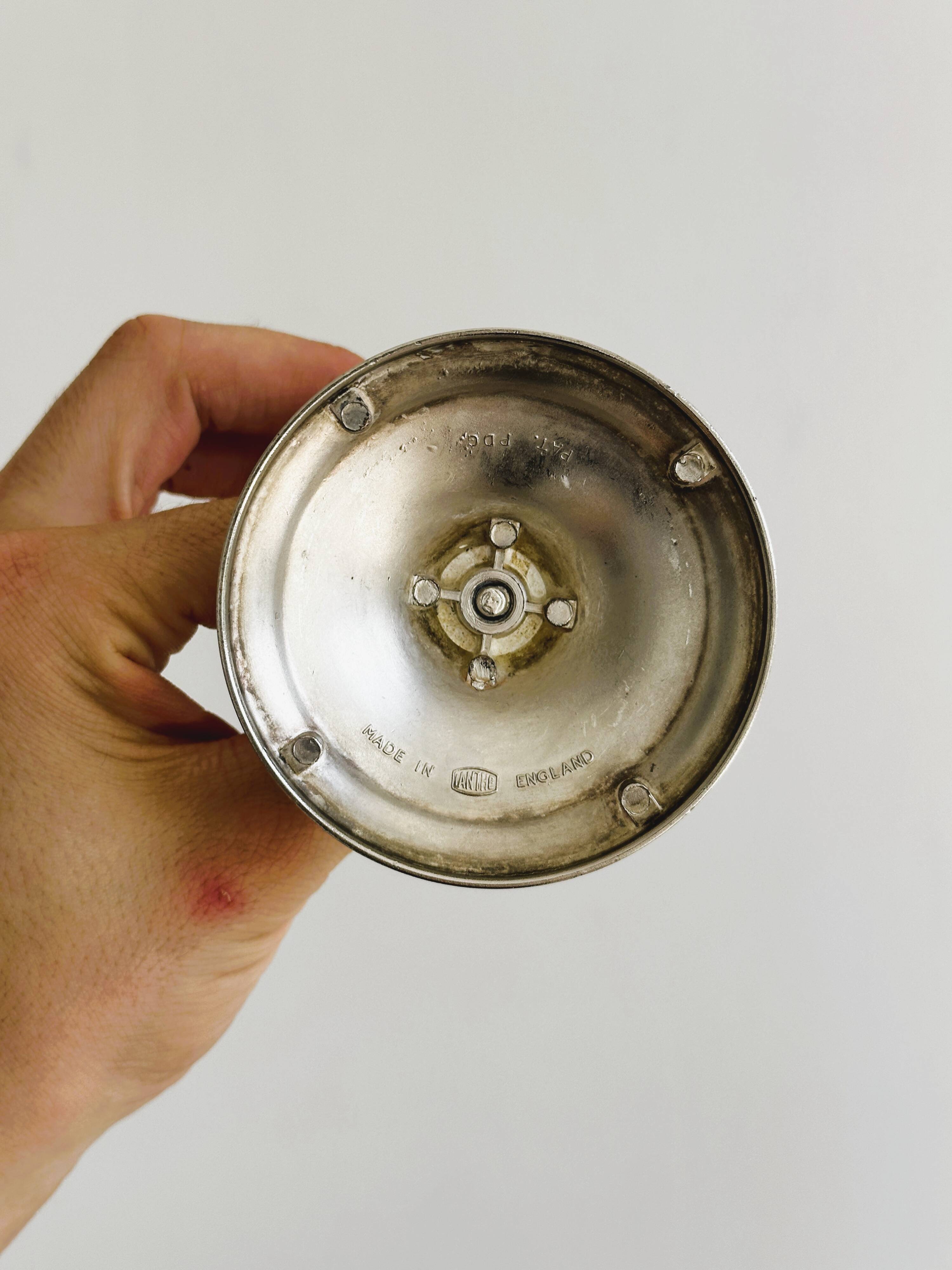 Antique patinated metal candle holder