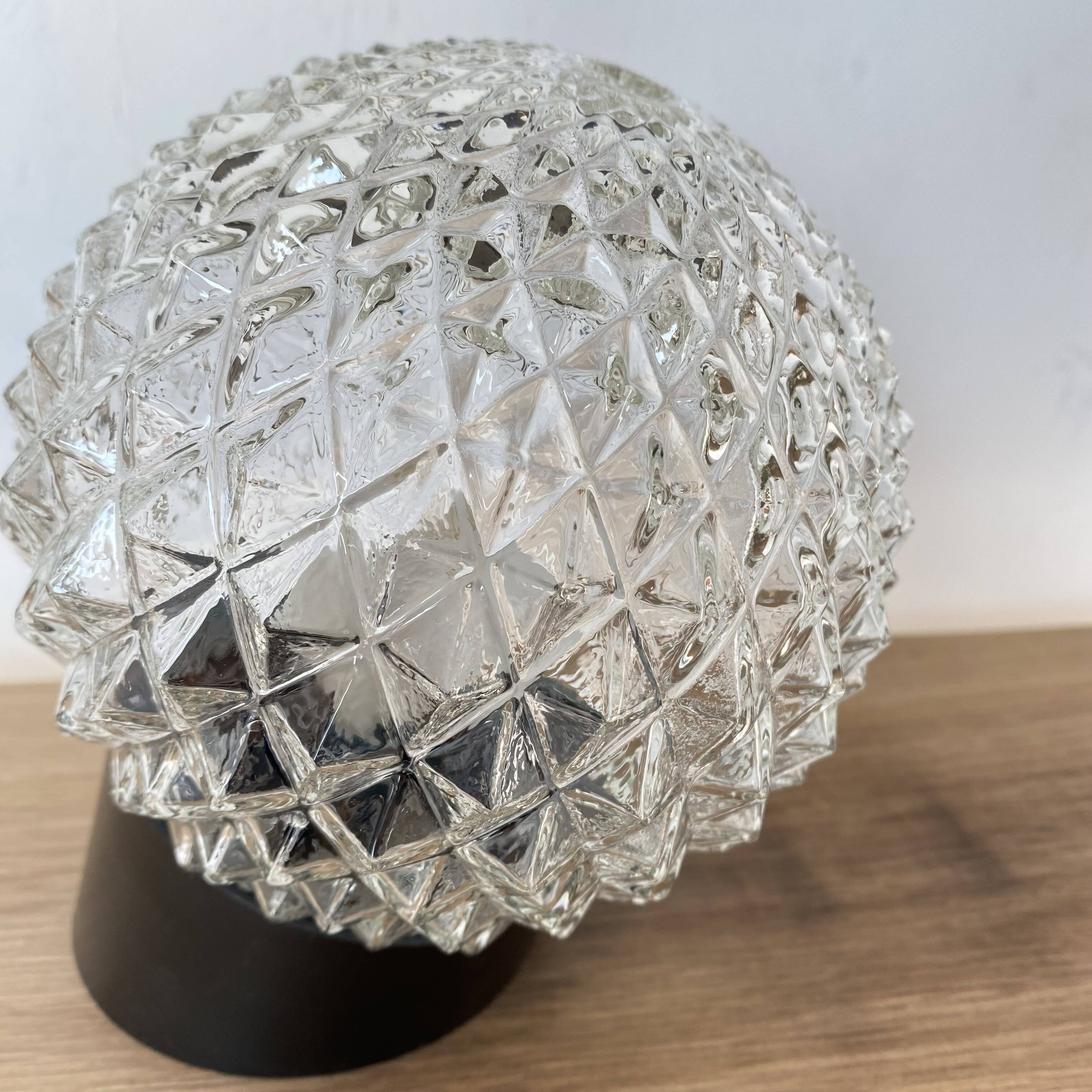 Pair of slanted glass wall lights with black plastic base, decorative v