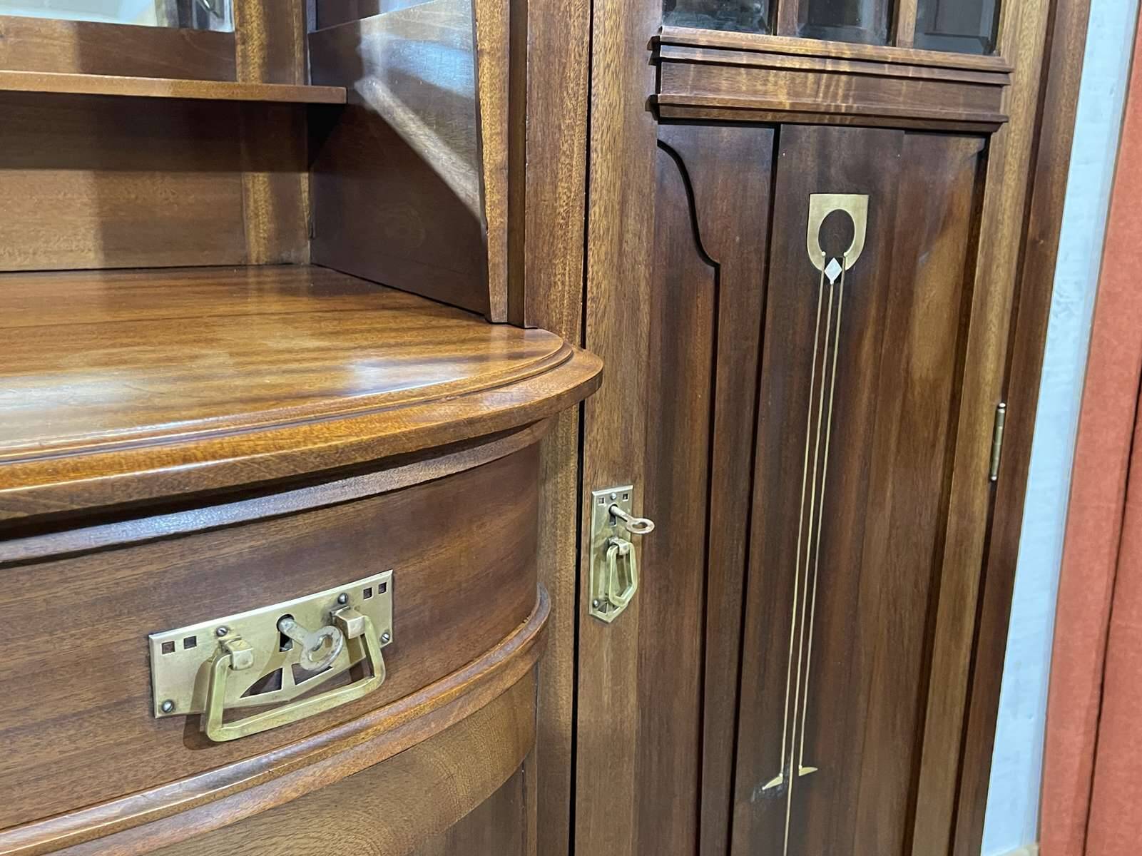 Art Nouveau mahogany buffet with clock in the style of G. Serrurier Bovy.