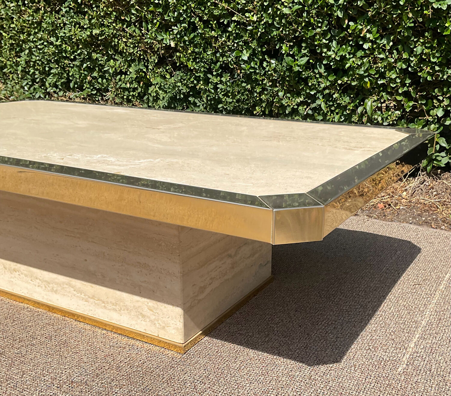 Vintage coffee table in travertine and brass.