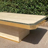 Vintage coffee table in travertine and brass.
