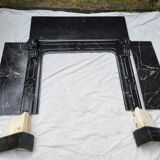 Pompadour fireplace with black marble modillions