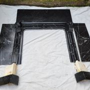 Pompadour fireplace with black marble modillions