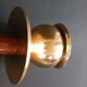 Two vintage wooden and brass candlesticks.