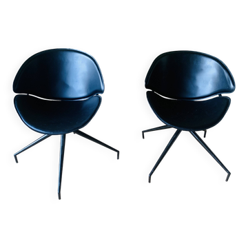 Pair of modernist swivel armchairs in black leather