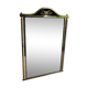 Neoclassical style mirror in brass and lacquered sheet metal.