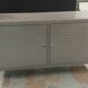 Small mouse gray industrial piece of furniture/sideboard.
