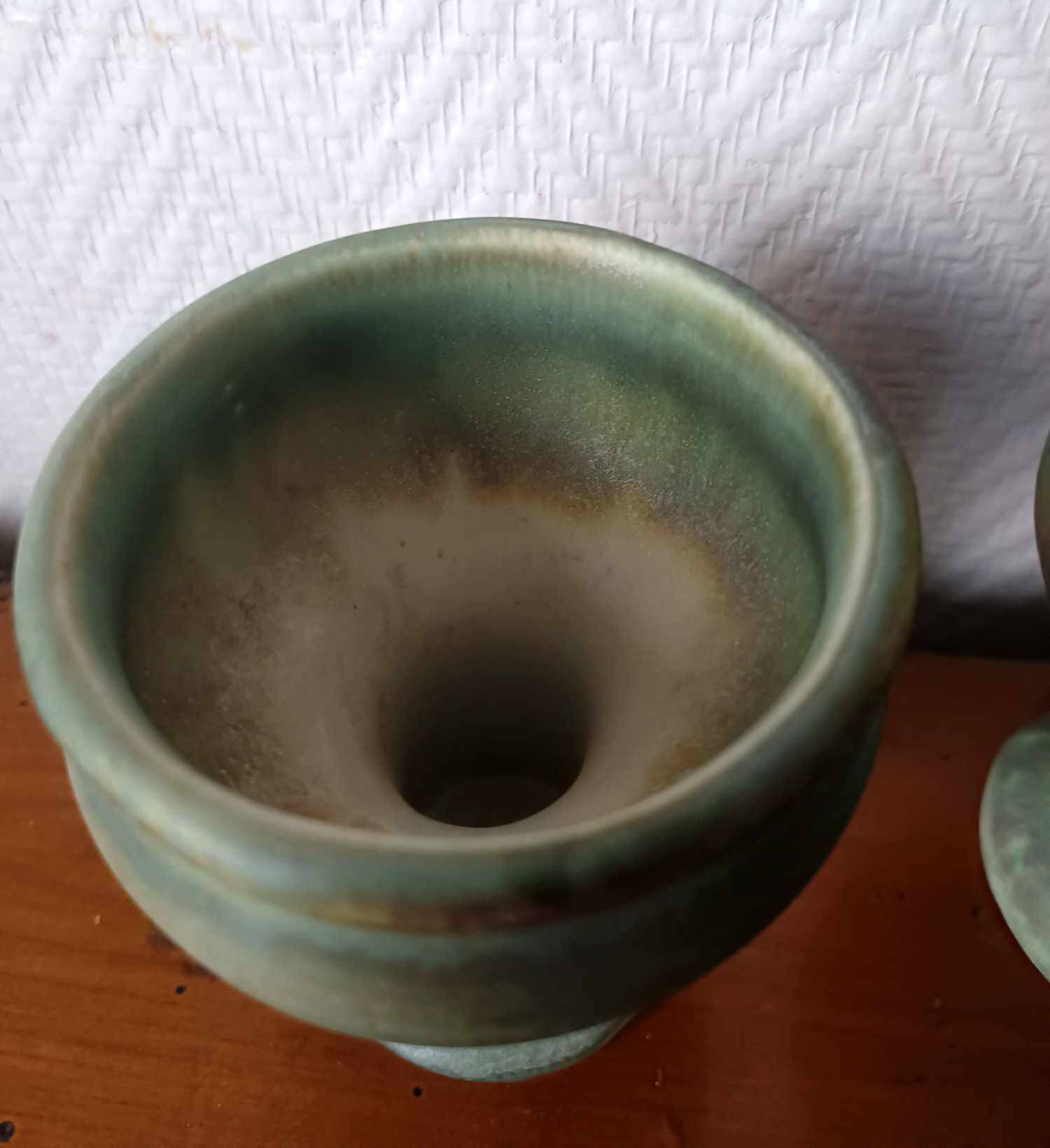 Pair of Belgian ceramic candlesticks on feet