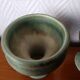 Pair of Belgian ceramic candlesticks on feet