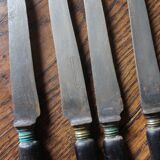 A set of 10 small knives with black wooden handles