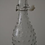 Clear bottle with pegs
