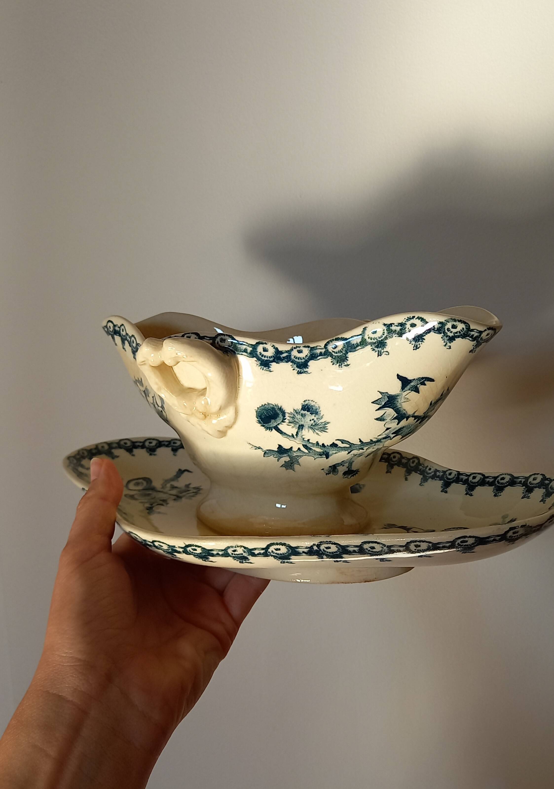 Old gravy boat on frame in terre de fer earthenware by gien, “chardons” model in blue-green