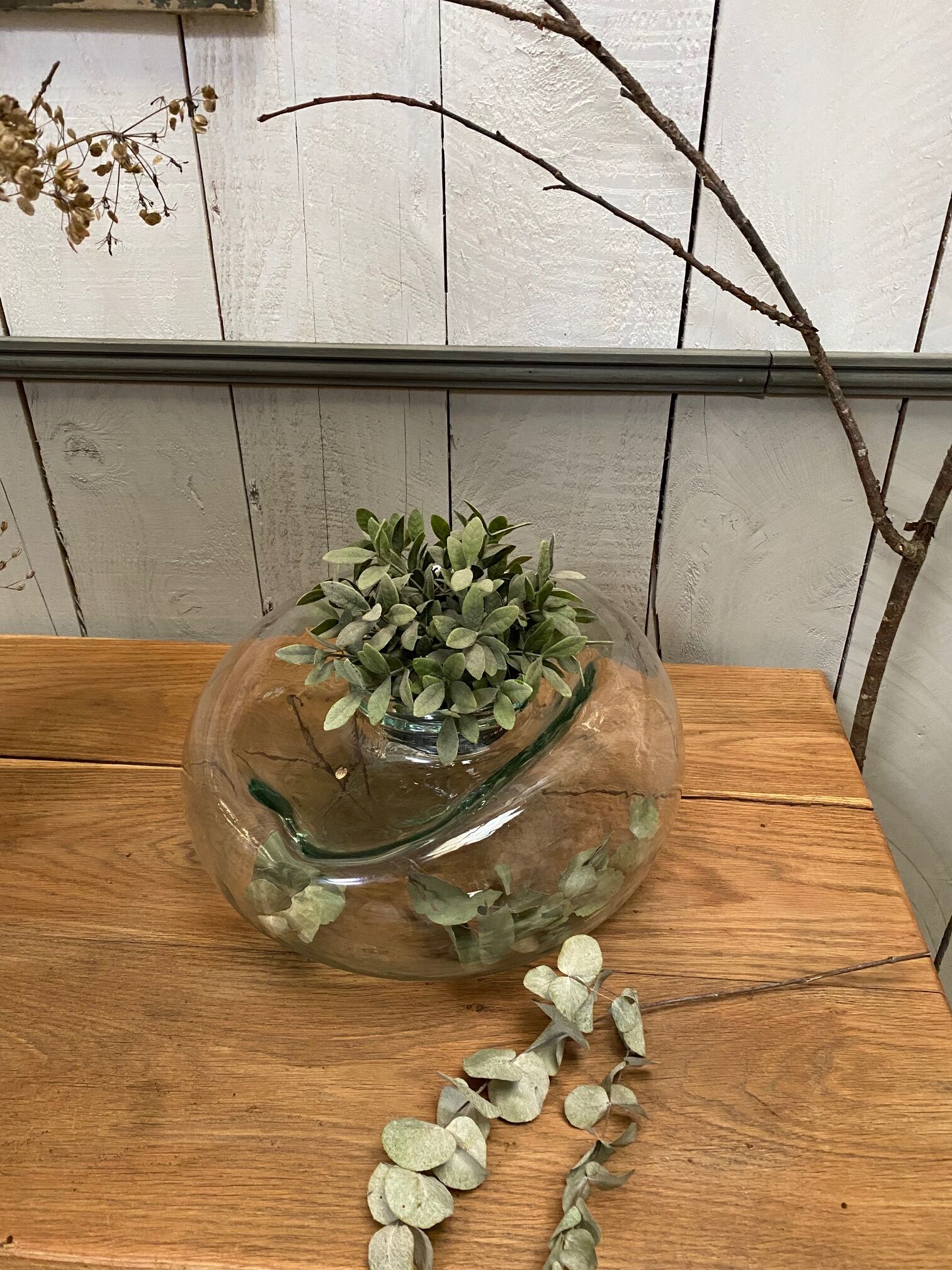 Old jar made of deformed glass