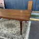 Rectangular extendable table in Scandinavian style made of teak.