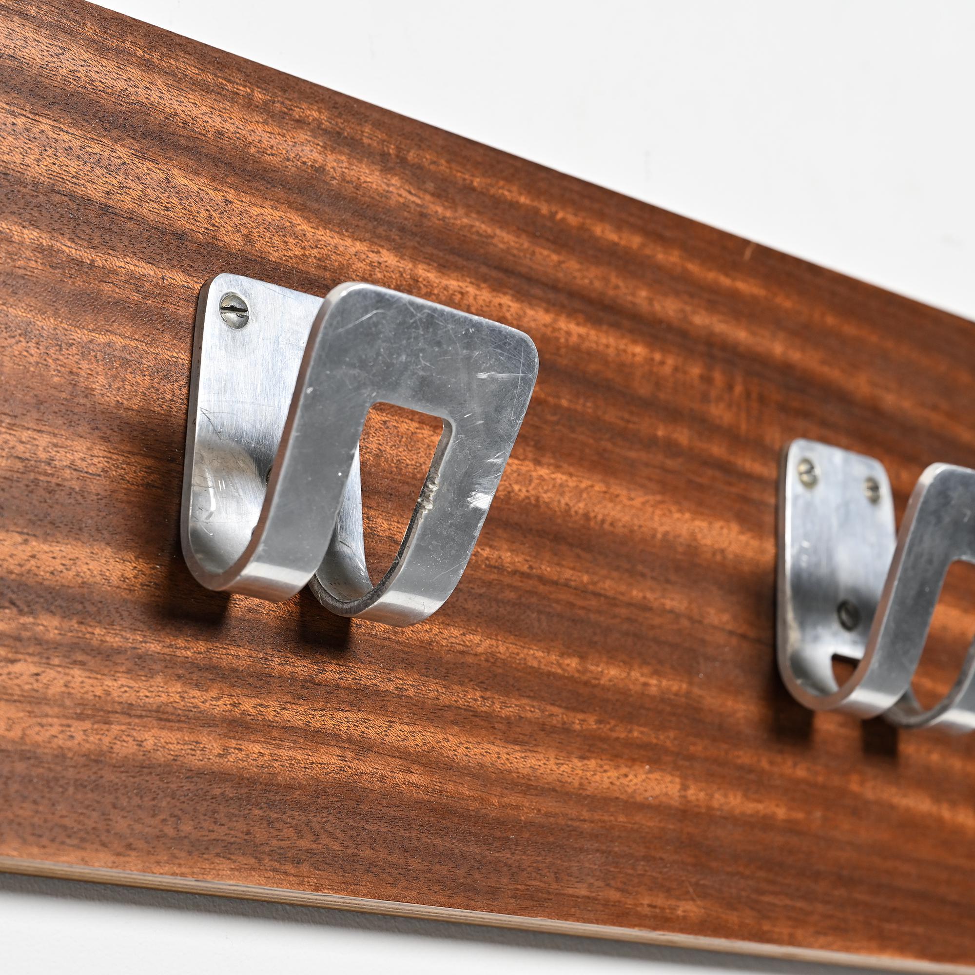 Wall coat rack and lights by Pierre Guariche for La Plagne, around 1968.