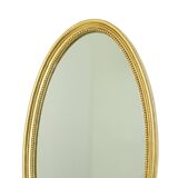 Miroir ovale doré de style Hollywood Regency