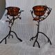 Pair of Art Deco style candle holders in wrought iron and amber blown glass.