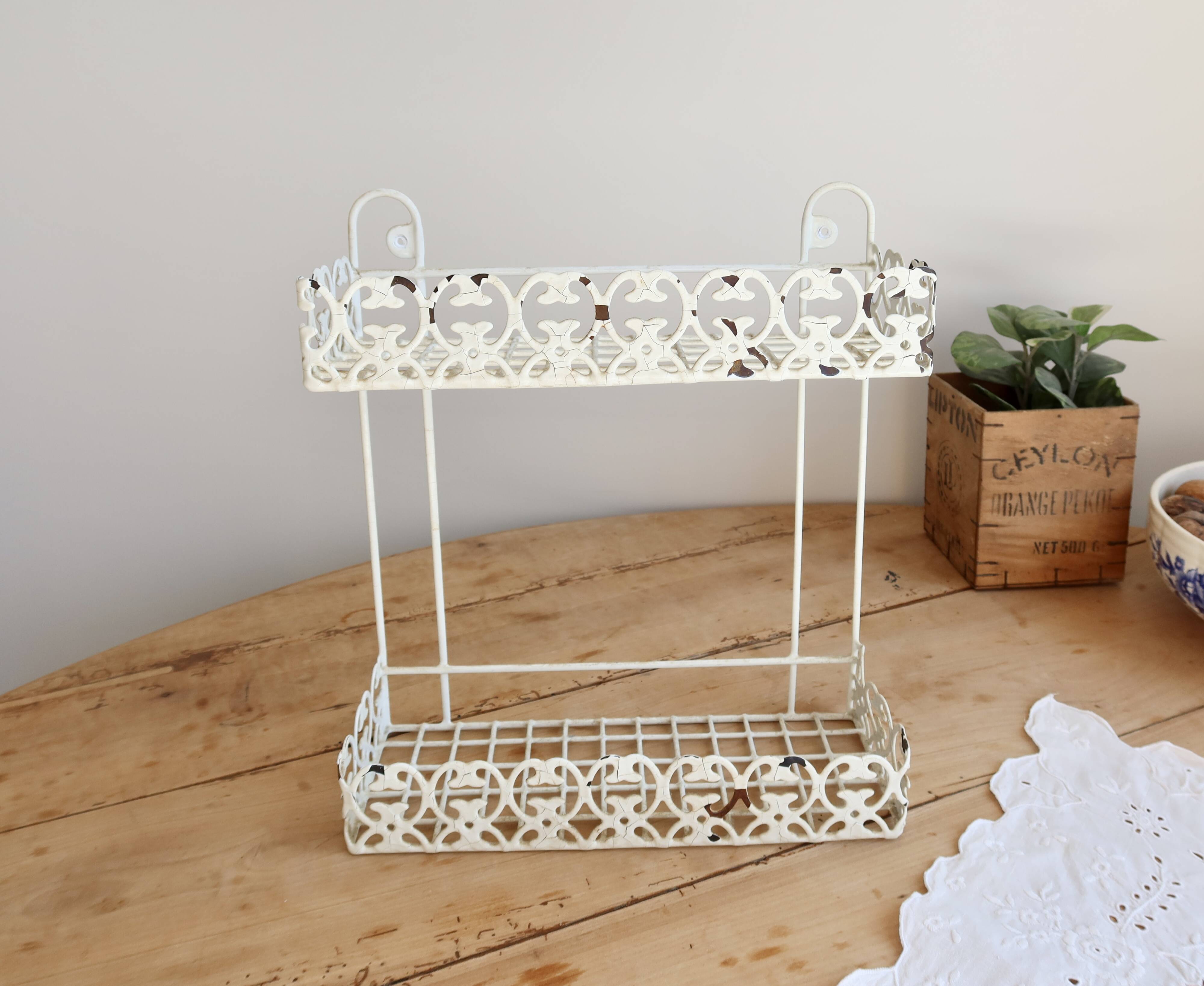 Vintage ivory patinated metal wall shelf