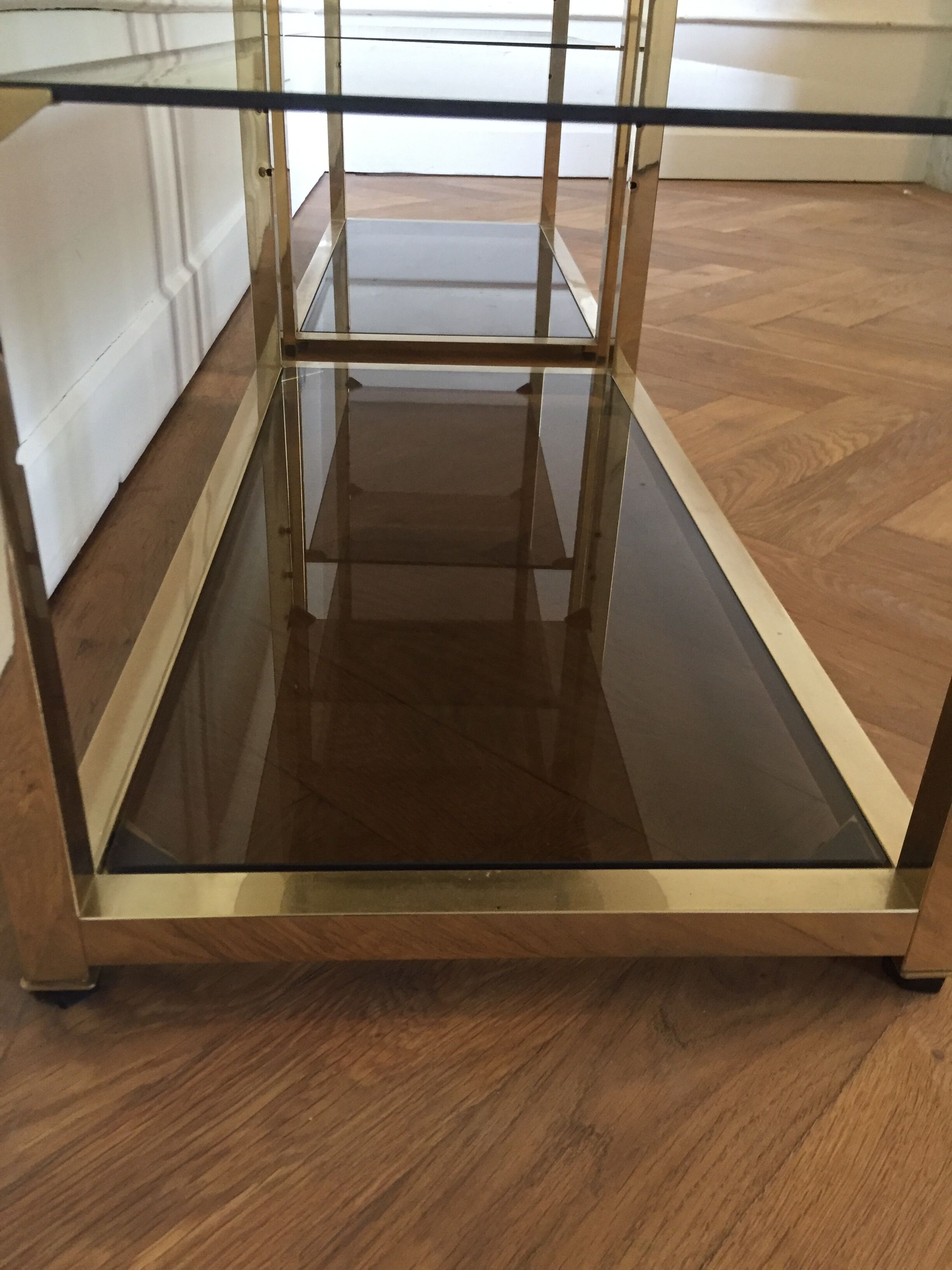 Pair of consoles brass shelves and smoked glass design Roche Bobois