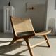 Reclining armchair in natural wood and woven rattan