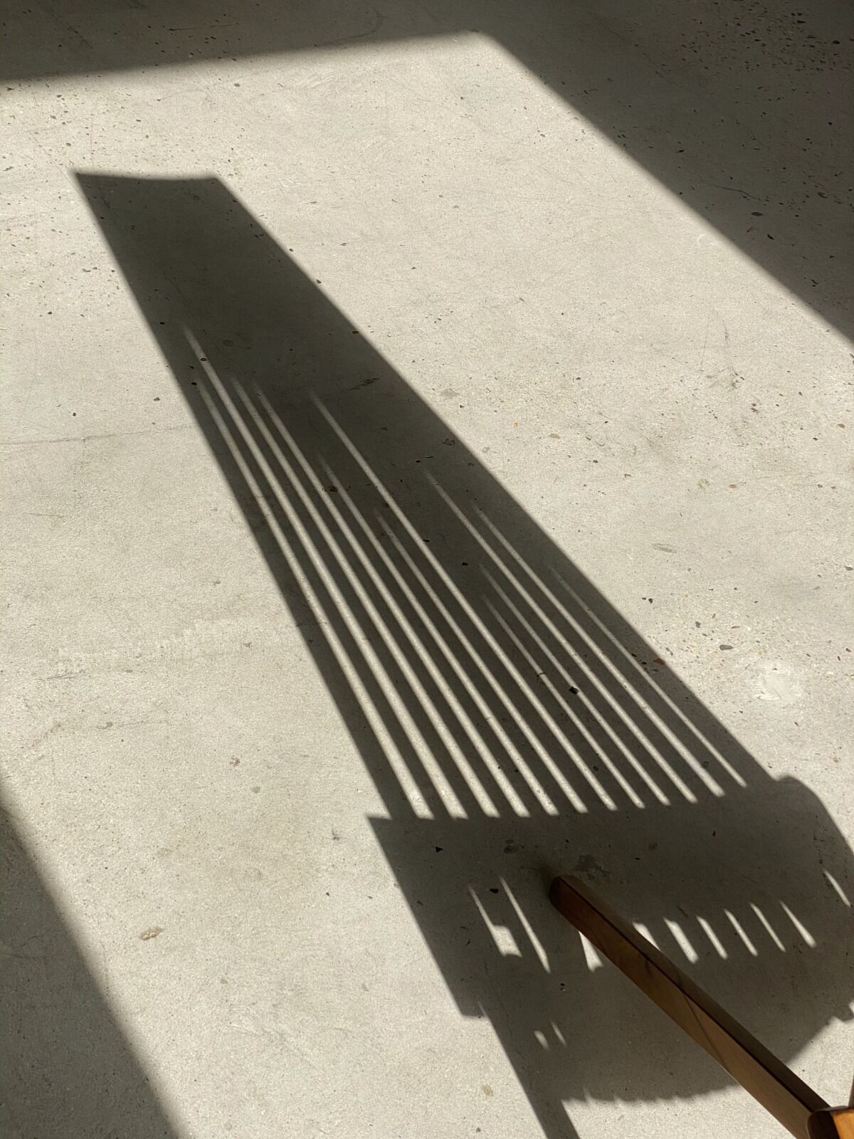 Foldable designer armchair in wooden slats