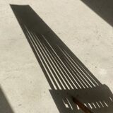 Foldable designer armchair in wooden slats