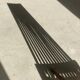 Foldable designer armchair in wooden slats