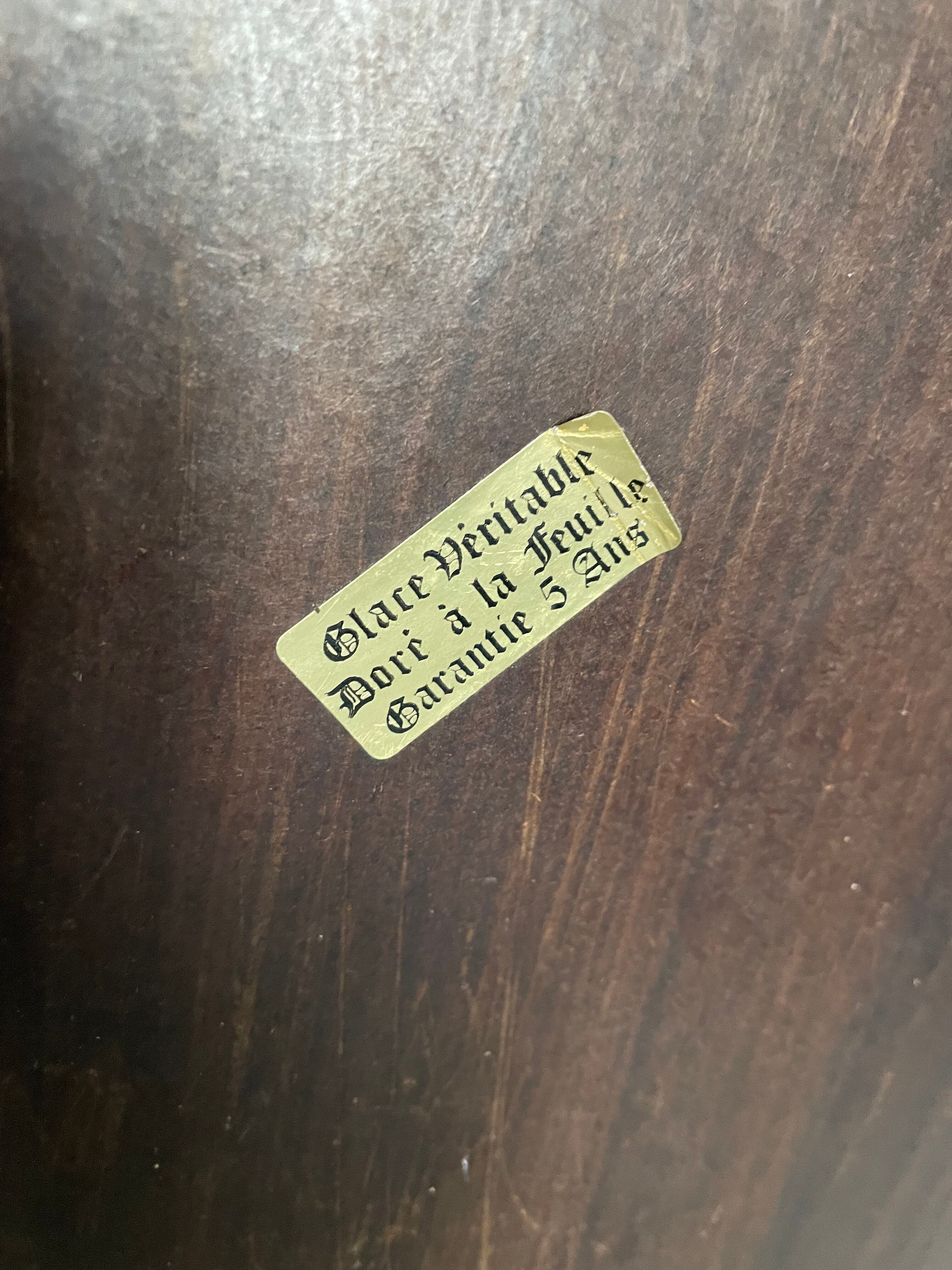 Golden rococo mirror with gold leaf