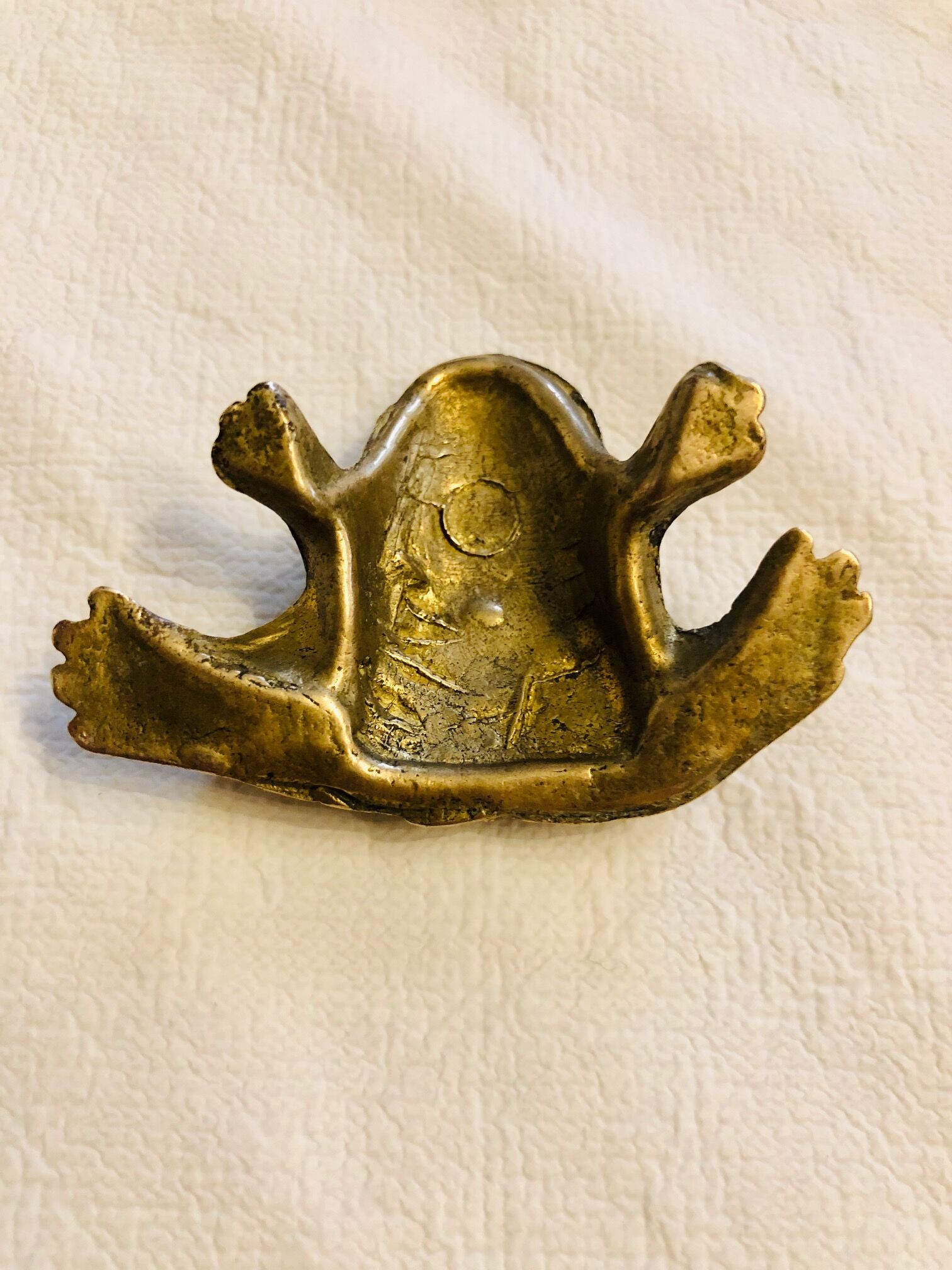 Small brass frog